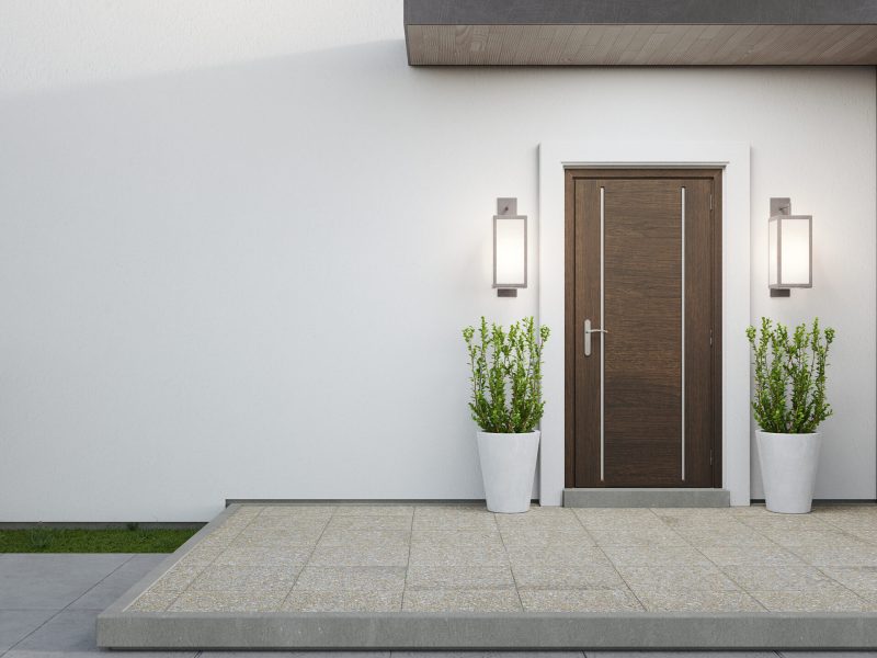 New house with wooden door and empty white wall. 3d rendering of